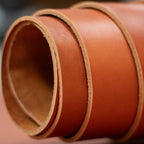Close-up of brown leather straps on a blurred background