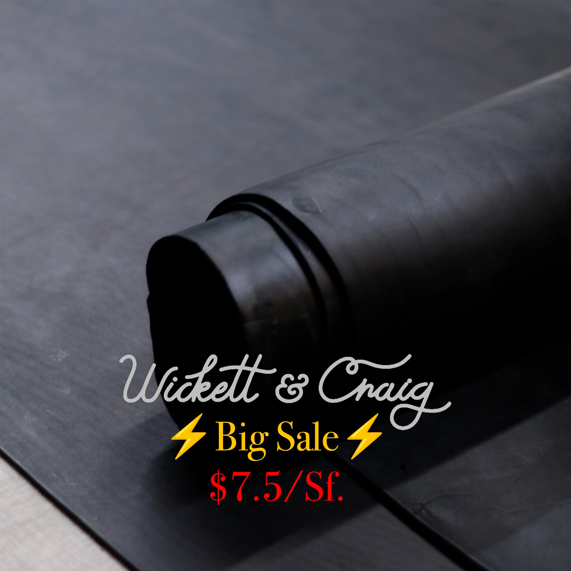 A close-up of a rolled black leather on a dark surface, with overlaid sale text reading 'Wickett & Craig Big Sale $7.5/Sf.